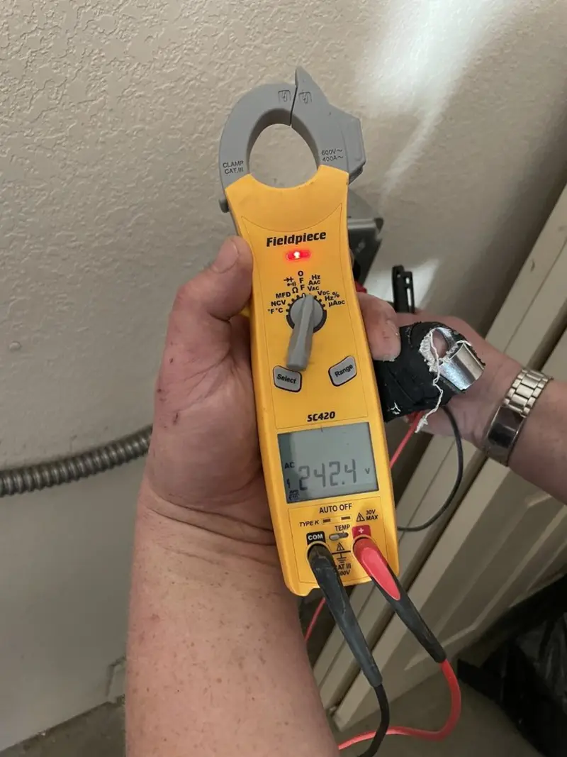 Voltage testing with clamp meter during Outlet Installation in Bridge City